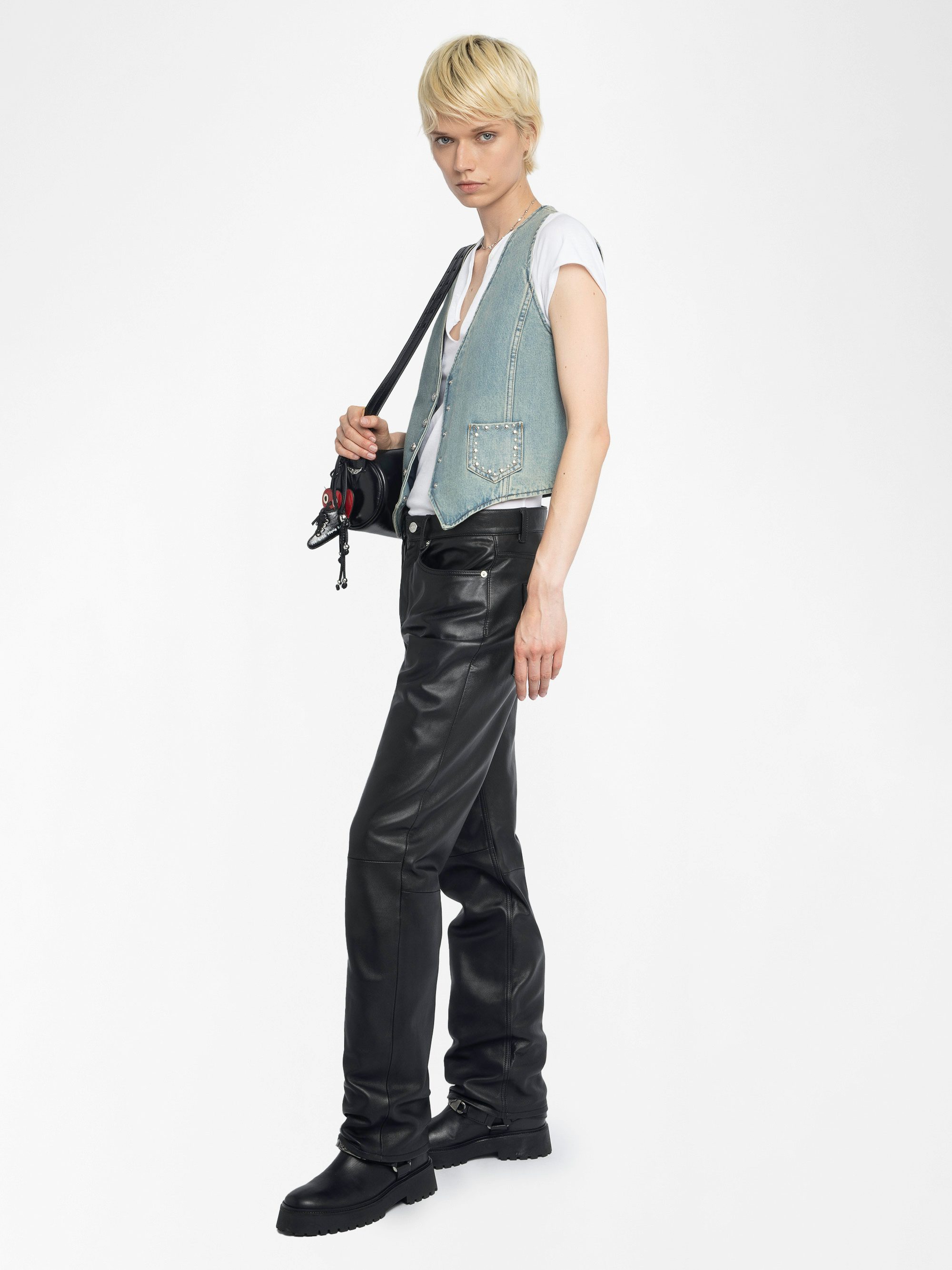 Gillier Denim Vest - This sleeveless denim vest is punctuated with silver studs and a raw edge finish—distressed just right. Layer it over everything, wear it like armor. Bold, free, undeniably Zadig.